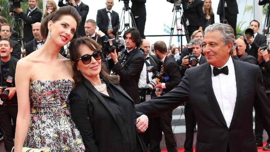 Christian Clavier (d), Chantal Lauby (c) et Frédérique Bel, acteurs du film "Qu'est-ce qu'on a fait au Bon Dieu?" au Festival de Cannes le 22 mai 2014