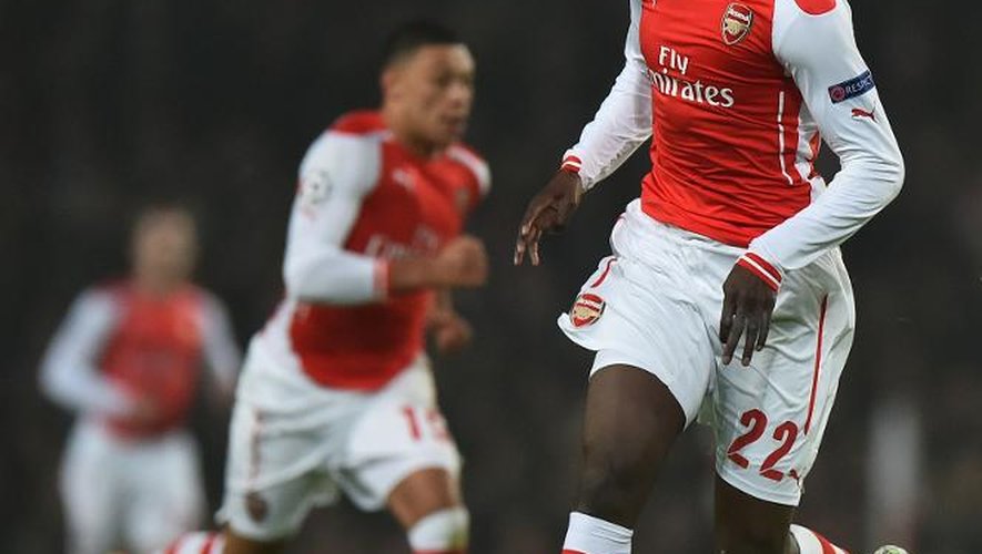 L'attaquant d'Arsenal Yaya Sanogo (d) lors du match de C1 contre Dortmund, le 26 novembre 2014 à Londres