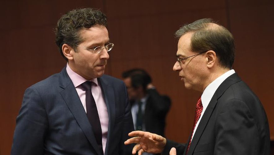 Le président de l'Eurogroupe Jeroen Dijsselbloem et l'ancien ministre grec des Finances Gikas Hardouvelis le 26 janvier 2015 à Bruxelles