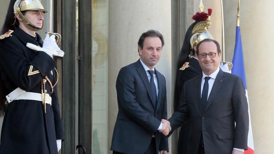 Le président français François Hollande reçoit le chef de l'opposition syrienne en exil, Khaled Khoja, à l'Elysée le 5 mars 2015