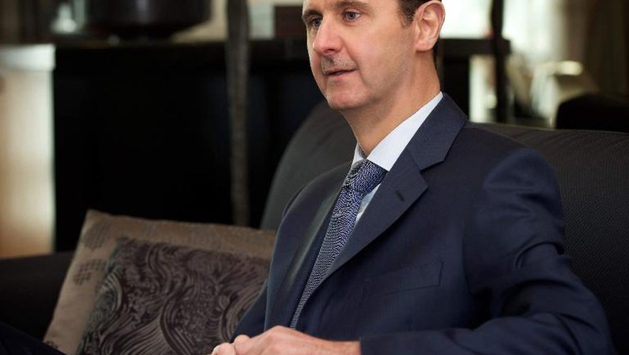 Photo fournie par l'agence Sana du président syrien Bachar al-Assad prise lors d'un entretien avec un magazine américain, le 26 janvier 2015 à Damas