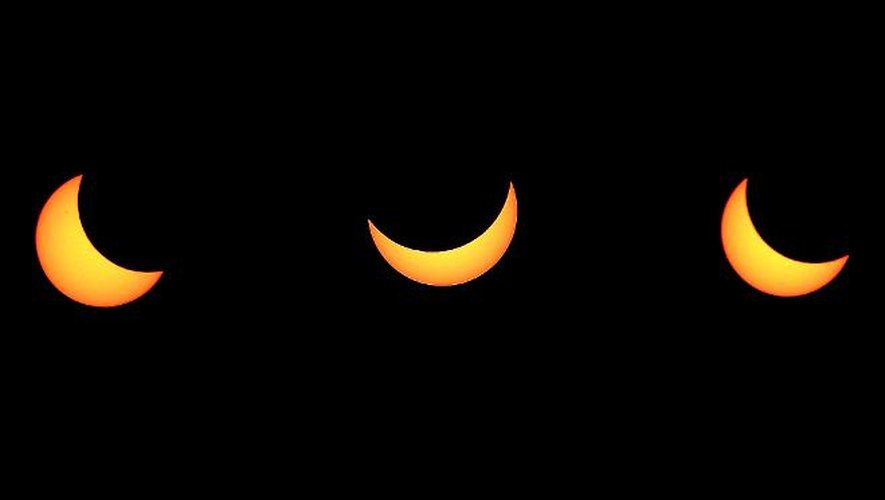 Montage de trois photos montrant la progression de l'éclipse solaire partielle le 20 mars 2015, observée depuis Strasbourg