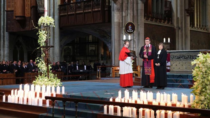 Le cardinal Rainer Maria Woelki (c) et Annette Kurschus (d) durant la cérémonie oecuménique dans la cathédrale de Cologne