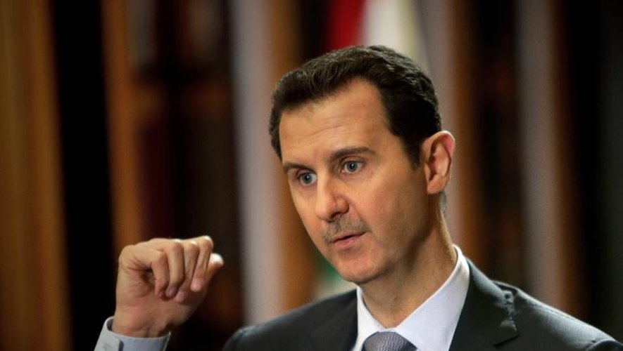 Le président syrien Bachar al-Assad accorde une interview à l'AFP au palais présidentiel à Damas
