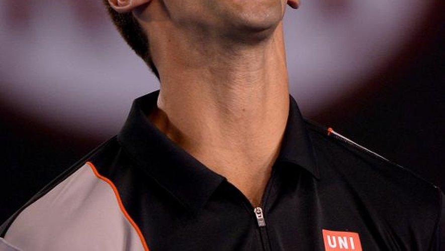 Le Serbe Novak Djokovic réagit lors de son match contre le Suisse Stanislas Wawrinka à l'Open d'Australie, le 21 janvier 2014 à Melbourne
