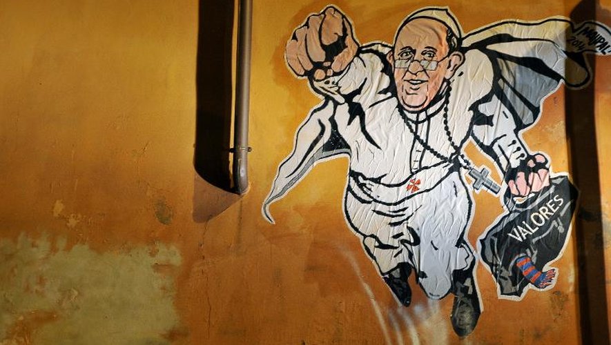 Un graffiti peint sur un mur de Rome montrant le pape François en superman, le 28 janvier 2014 à Rome