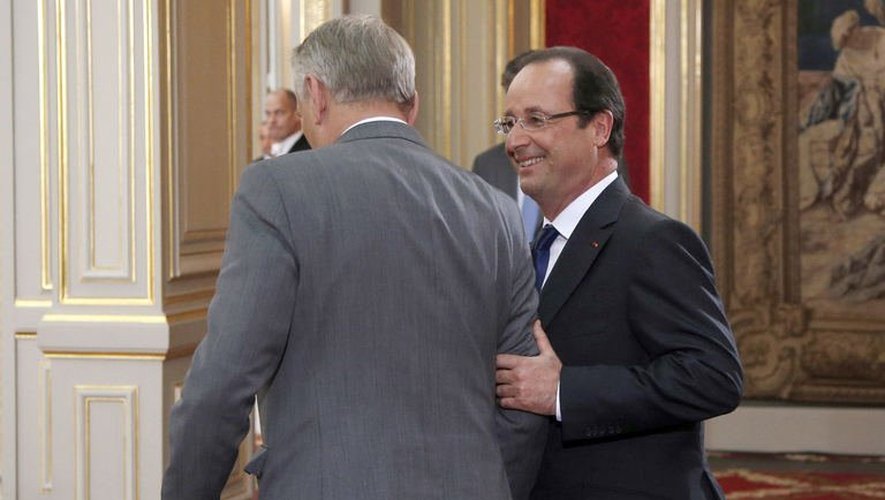 François Hollande sort avec le Premier ministre Jean-Marc Ayrault, le 16 mai 2013, à l'issue de sa conférence de presse