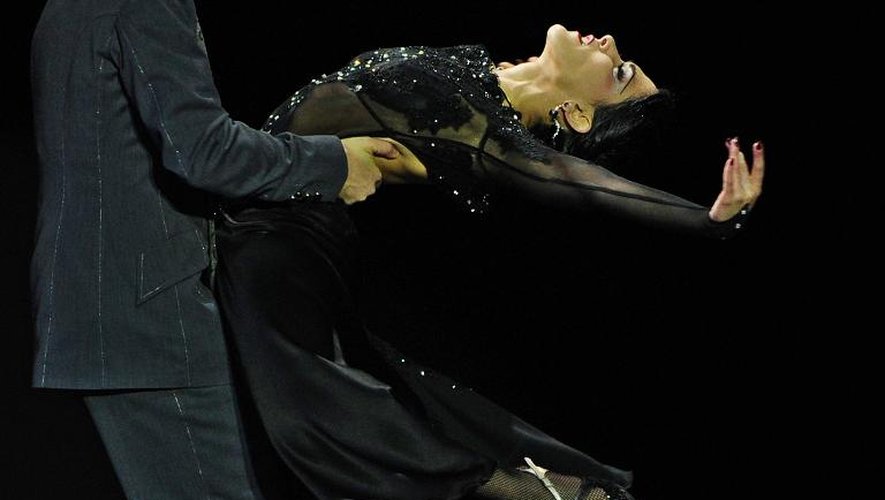 Une pratique régulière du tango, animé par des artistes, a pu améliorer spectaculairement l'état de certains patients. Ici un couple dans un championnat du monde de tango à Buenos Aires le 27 août 2013