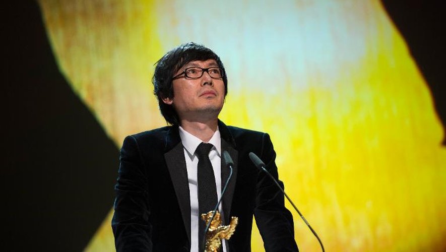 Le réalisateur chinois Diao Yinan, lauréat de l'Ours d'or du meilleur film pour "Bai Ri Yan Huo" (Black Coal, Thin Ice) à Berlin le 15 février 2014