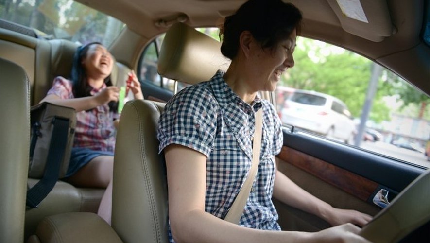 Li Na en voiture avec sa fille Nancy, le 12 mai 2013 à Pékin