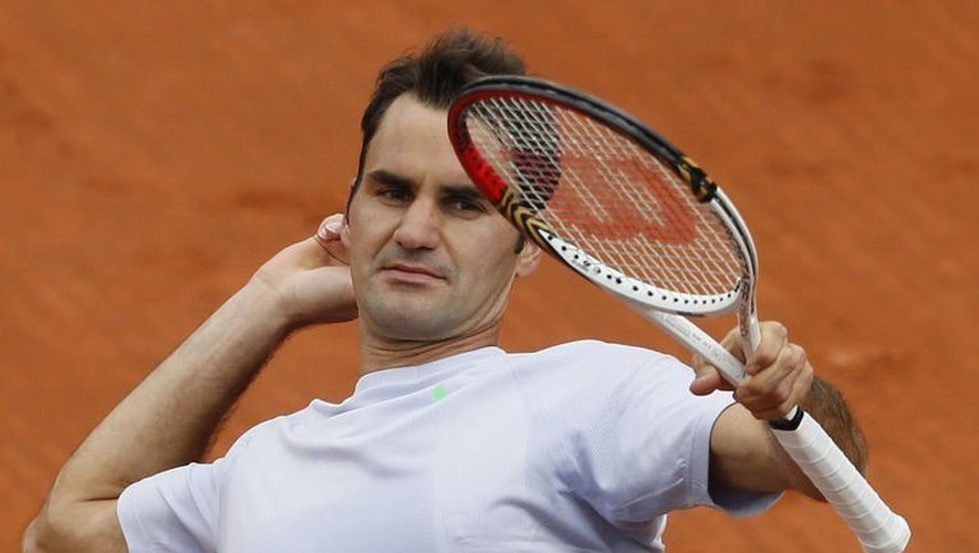 Le Suisse Roger Federer exulte après sa victoire au 1er tour de Roland-Garros, le 26 mai 2013 à Paris