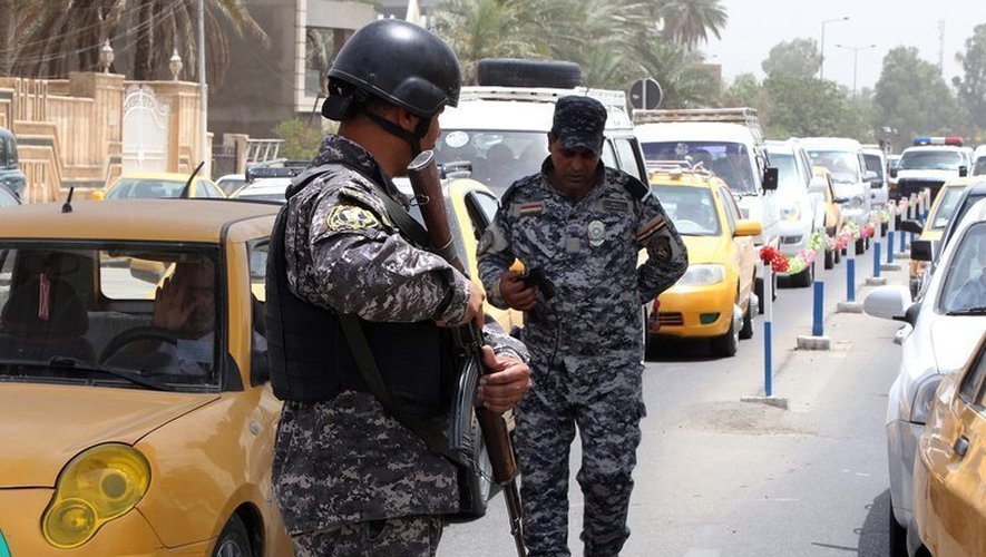 Des officiers de sécurité à Bagdad, le 29 mai 2013