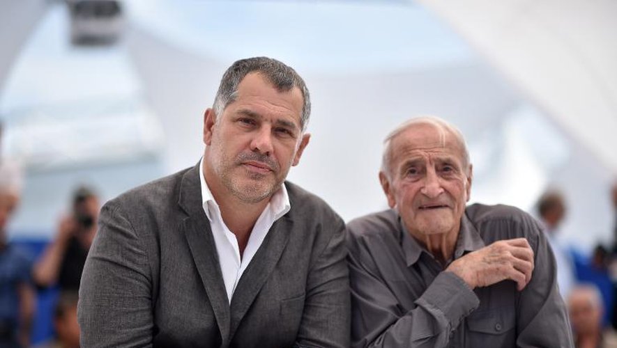 Le réalisateur français Luc Jacquet ("La glace et le ciel") et le scientifique Claude Lorius (D), le 23 mai 2015 à Cannes