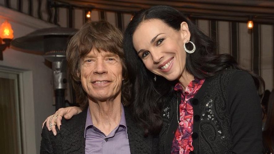 Le chanteur Mick Jagger et sa compagne L'Wren Scott lors du lancement d'une collection de la marque Banana Republic, le 19 novembre 2013 à Los Angeles