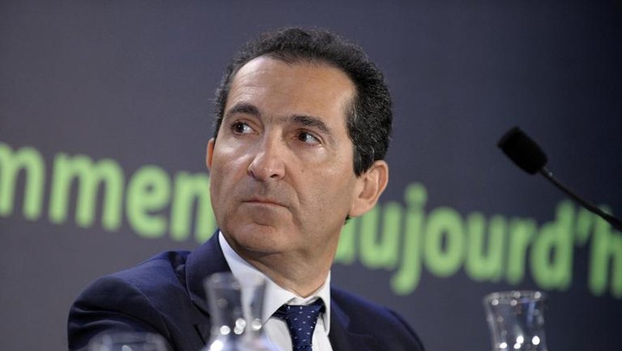 Le patron d'Altice, Patrick Drahi, confiant en son projet de mariage entre sa filiale Numericable et SFR, deuxième opérateur télécoms français lors d'une conférence de presse le 17 mars 2014