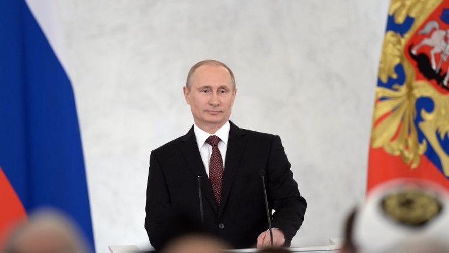 Le président russe Vladimir Poutine devant le parlement le 18 mars 2014 à Moscou