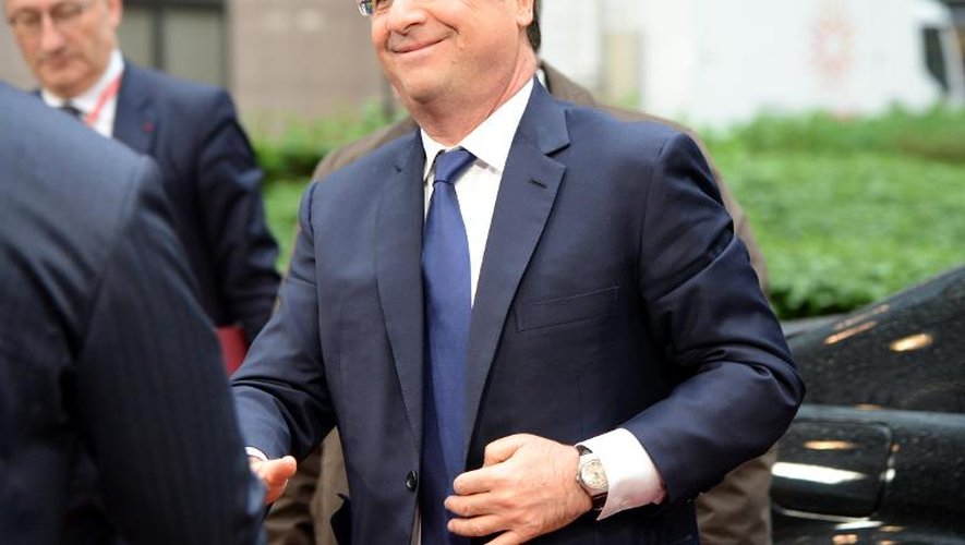 Le président français François Hollande à son arrivée au siège de l'Union Européenne à Bruxelles vendredi 21 mars 2014, où a été signé un le volet politique d'un accord d'association avec l'Ukraine