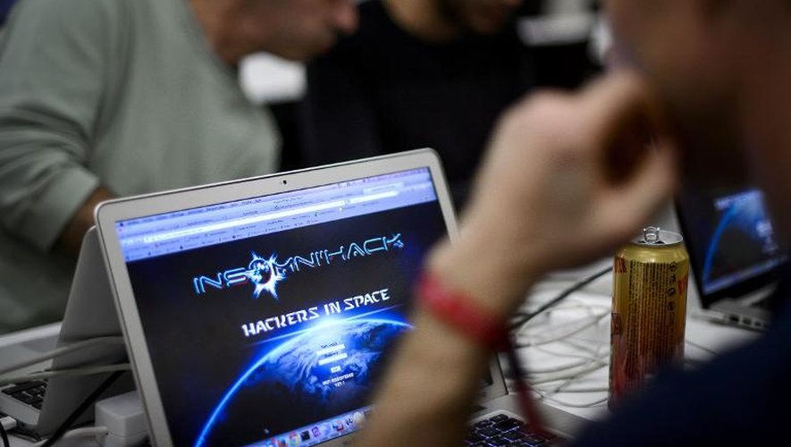 Des pirates informatiques au salon Insomni'Hack de Genève, le 21 mars 2014