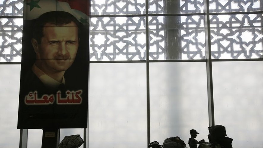 Portrait de Bachar al-Assad à l'aéroport de Damas, le 15 mai 2013