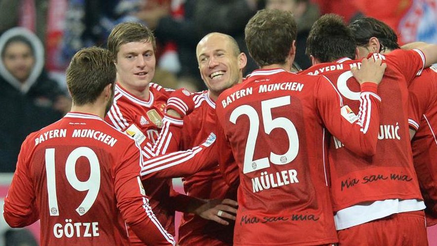 Les joueurs du Bayern Munich après un but lors du match de Championnat d'Allemagne contre le Bayer Leverkusen le 15 mars 2014 à Munich