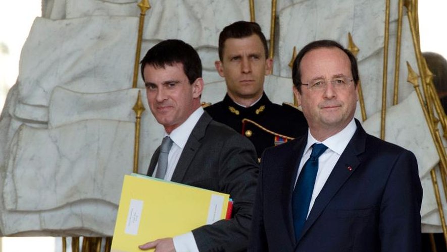 Manuel Valls et Francois Hollande à l'issue du Conseil des ministres le 19 mars 2014 à l'Elysée à Paris
