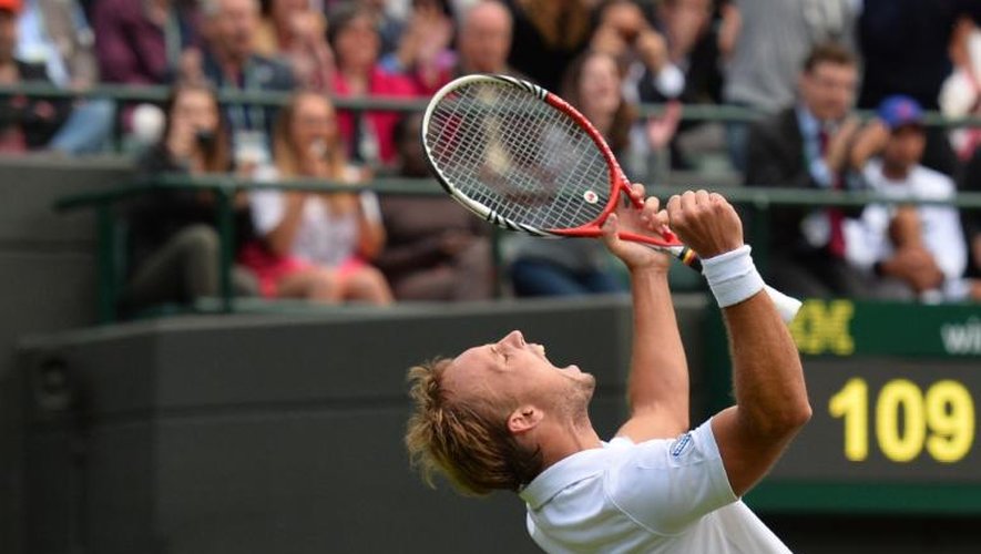 Le Belge Steve Darcis célèbre sa victoire sur Rafael Nadal lors du premier tour à Wimbledon, le 24 juin 2013