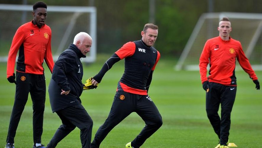 L'attaquant de Manchester Wayne Rooney (2e d) participe normalement à l'entraînement de son équipe au centre de Carrington, le 8 avril, à la veille du quart de finale retour face au Bayern à Munich