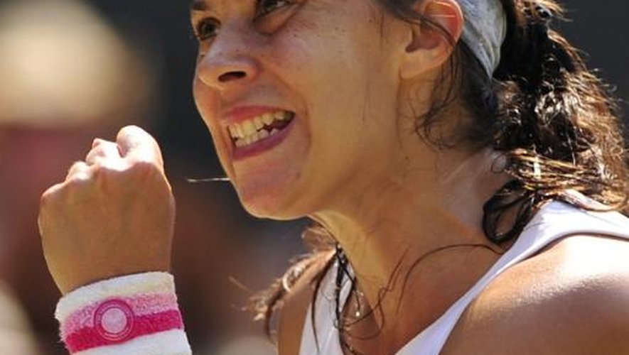 La rage de vaincre de la Française Marion Bafrtoli contre l'Allemande Sabine Lisicki en finale du tournoi de Wimbledon le 6 juillet 2013 à Londres
