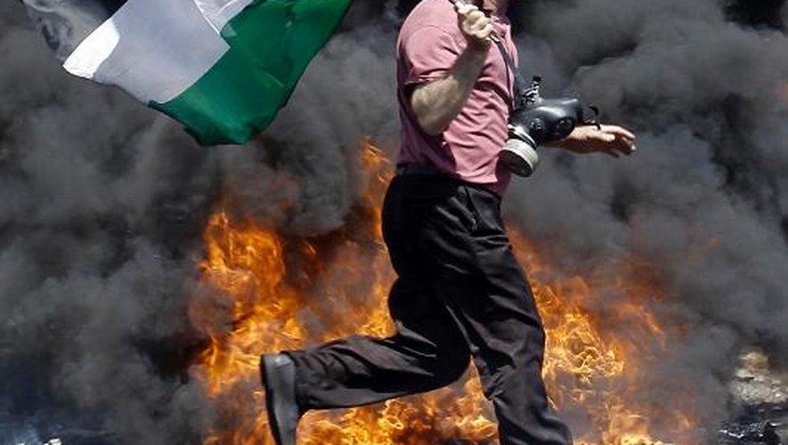Un Palestinien lors de heurts survenus pendant une manifestation le 25 avril 2014 contre les expropriations de Palestiniens à Kfar Qaddum près de Naplouse