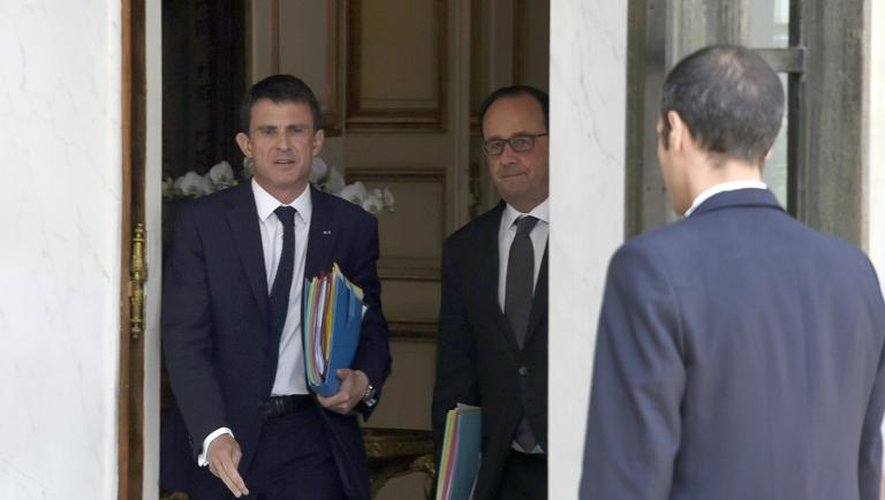 Le Premier ministre Manuel Valls et le président François Hollande à l'issue du Conseil de défense le 24  juin 2015 à l'Elysée à Paris
