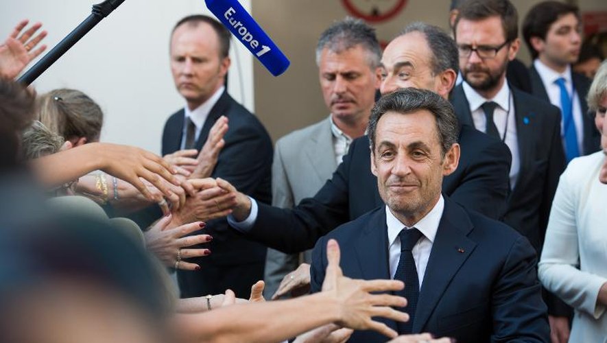Nicolas Sarkozy à son arrivée le 8 juillet 2013 au siège de l'UMP à Paris