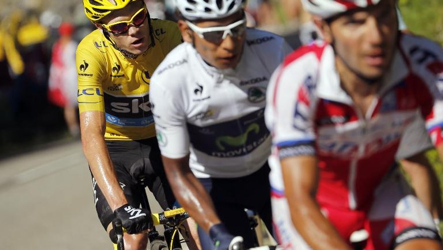 Le britannique Christopher Froome (en jaune), le Colombien Nairo Quintana (C) et l'Espagnol Joaquim Rodriguez Oliver sur la 20e étape du Tour de France entre Annecy and Annecy-Semnoz le 20 juillet 2013
