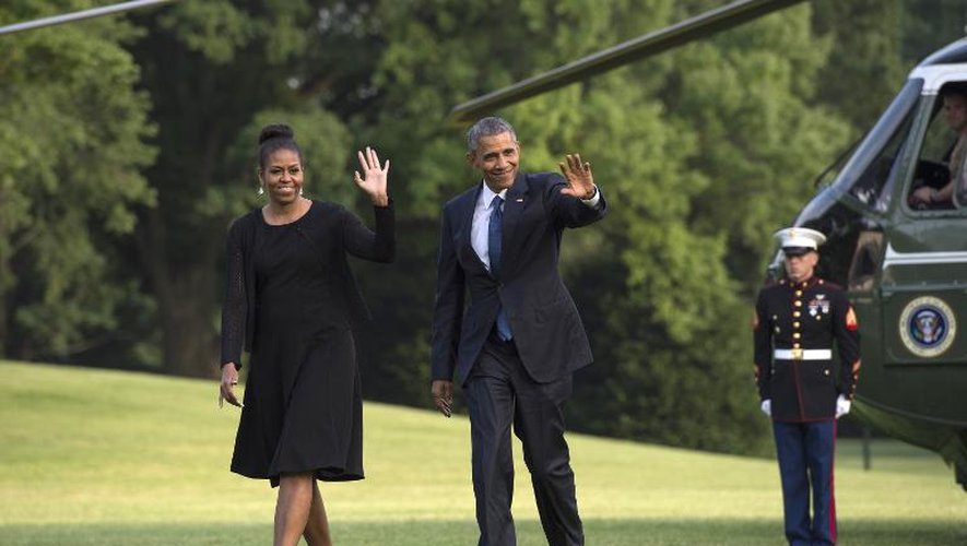 Le président américain Barack Obama et son épouse Michelle arrivent à la Maison Blanche, de retour de Charleston, le 26 juin 2015