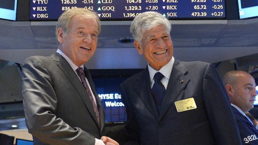Les patrons de Publicis Maurice Lévy (g) et d'Omnicom John Wren annoncent leur projet de fusion à la Bourse de New York, le 29 juillet 2013