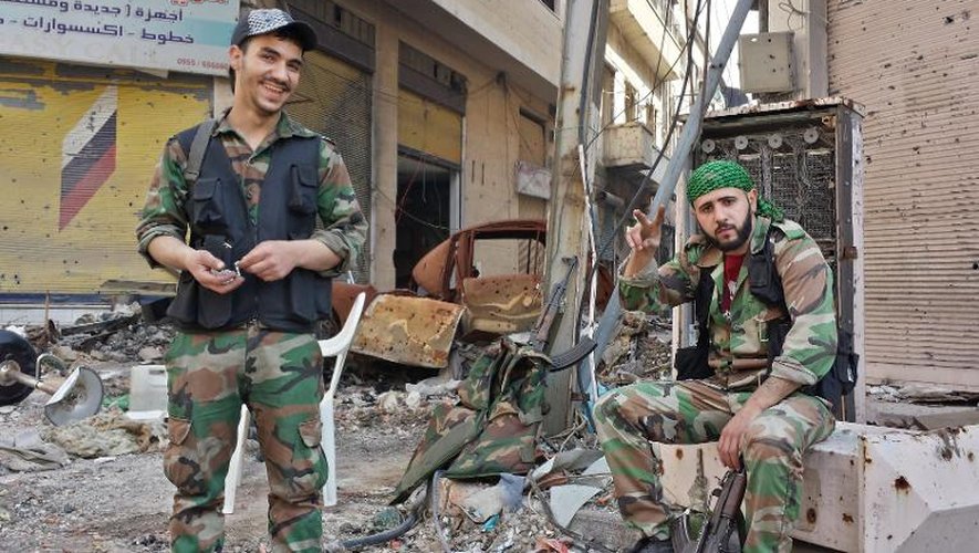 Des militaires syriens le 9 mai 2014 dans la ville de Homs