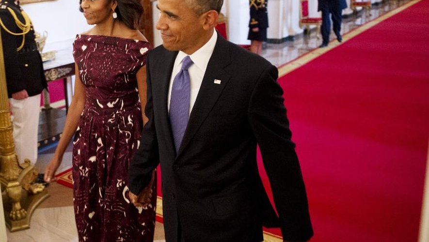 Le président Barack Obama et sa femme Michelle, le 10 juillet 2013 lors d'une cérémonie à Washington.
