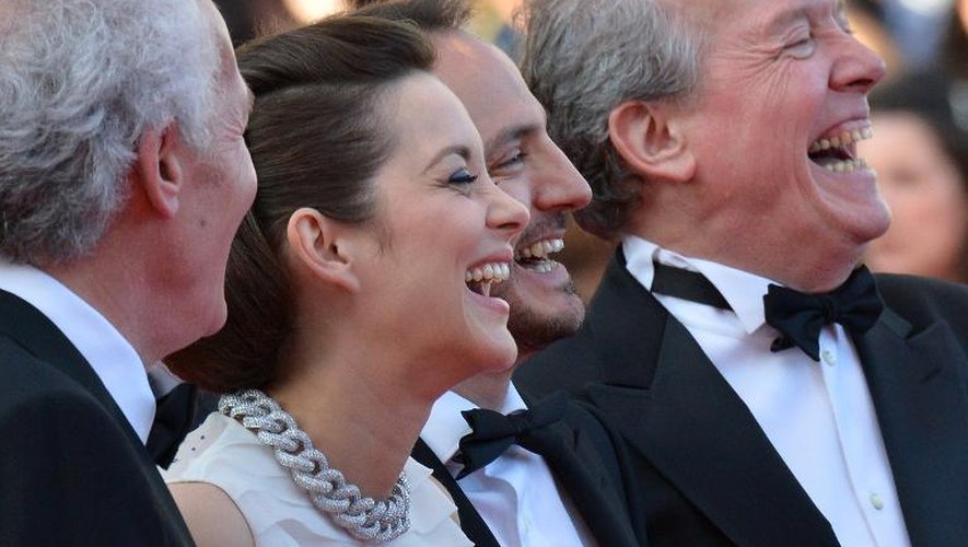 Marion Cotillard, Fabrizio Rongione et Luc Dardenne à leur arrivée pour la projection du film  "Deux jours, une nuit" le 20 mai 2014 à Cannes