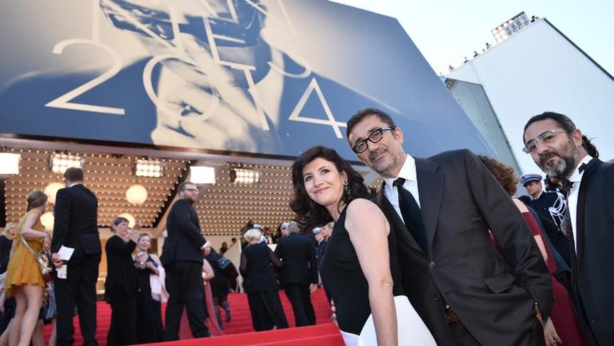 Le réalisateur turc Nuri Bilge Ceylan et son épouse, l'actrice Ebru Ceylan à leur arrivée au palais des festivals à Cannes pour la remise du palmarés, le 24 mai 2014