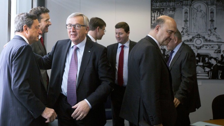 Le président de la BCE Mario Draghi, le président de la Commission européenne Jean-Claude Juncker, et le commissaire européen Pierre Moscovici le 24 juin 2015 à Bruxelles