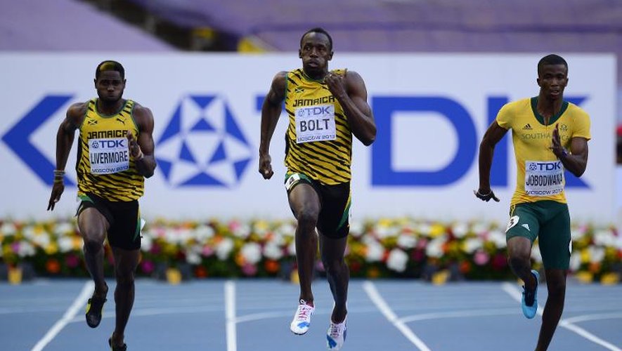 Le Jamaïcain Usain Bolt (c) lors de sa demi-finale du 200 m aux Mondiaux, le 16 août 2013 à Moscou