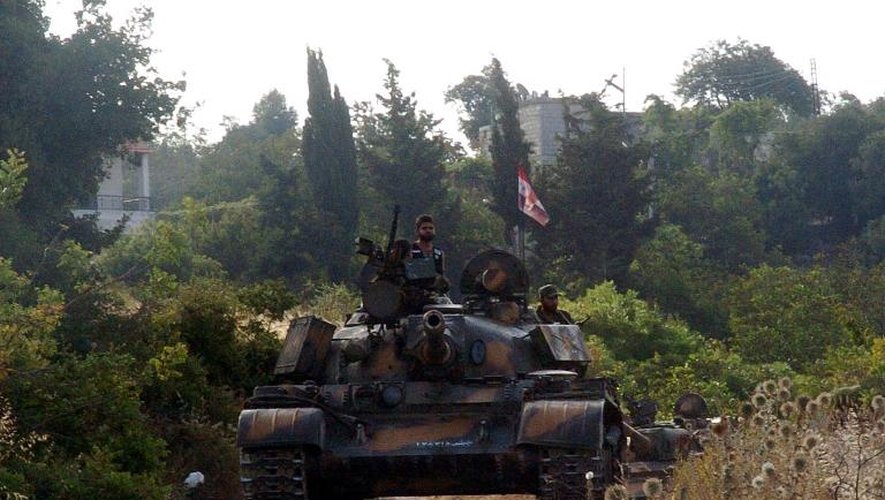 Un char de l'armée syrienne positionné dans la région de Lattaquié, sur une photo de l'agence syrienne SANA, le 8 août 2013