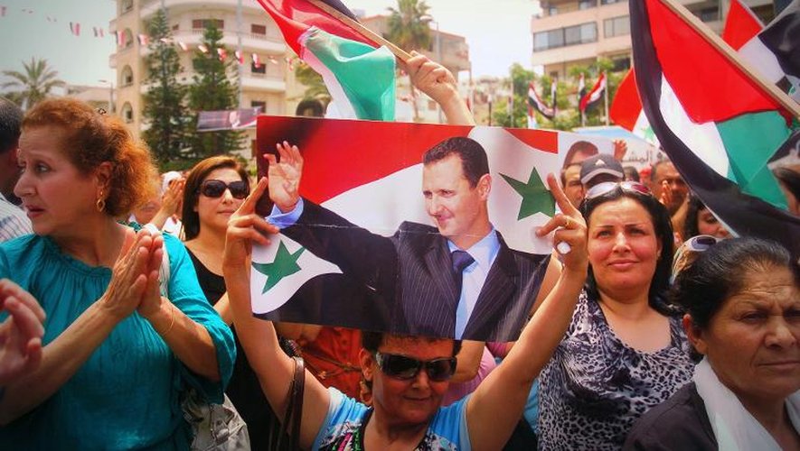 Photo distribuée par l'Agence de presse officielle syrienne Sana le 29 mai 2014 montrant un rassemblement en soutien au régime syrien de Bachar al-Assad