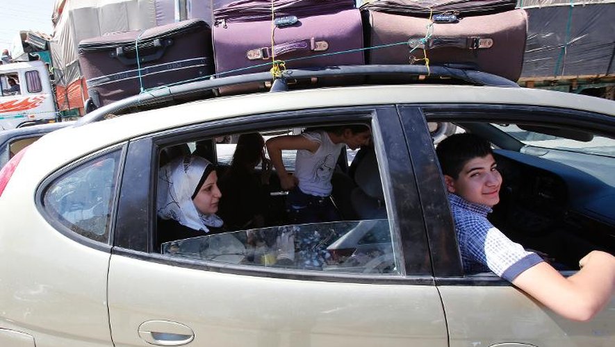 Une famille syrienne au poste frontière de Masnaa le 31 août 2013