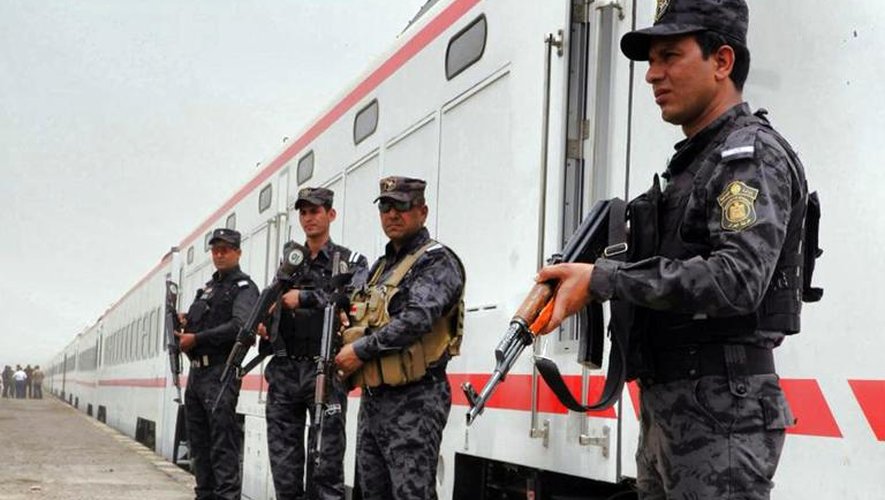 Policiers ikraiens dans une gare à Bagdad, le 14 juin 2014