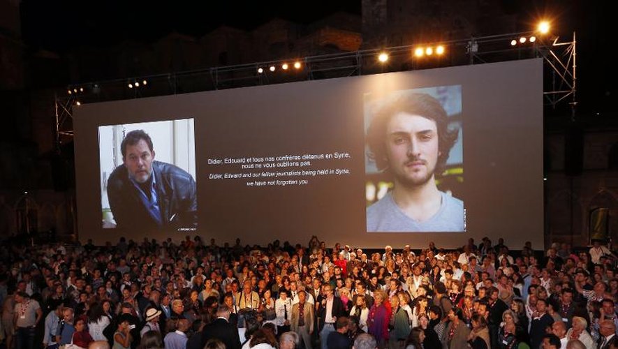 Photo prise le 5 septembre à Perpignan lors du festival de photographie Visa pour l'Image montrant les visages de Didier François et Edouard Elias, détenus en Syrie