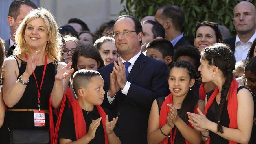 Le président François Hollande participe à un concert gratuit donné par des enfants au palais de l'Elysée le 21 juin 2014