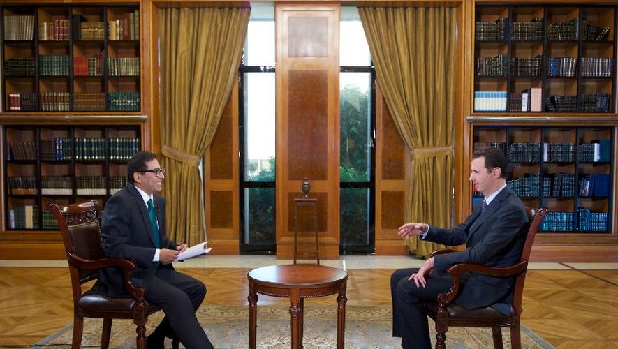 Photo transmise par l'agence Sana montrant le président syrien Bachar al-Assad le 25 septembre 2013 lors d'une interview avec la chaîne vénézuélienne Telesur