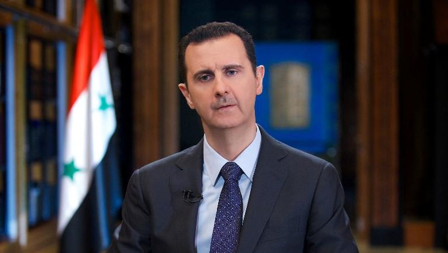Photo transmise par l'agence Sana montrant le président syrien Bachar al-Assad le 25 septembre 2013 lors d'une interview avec la chaîne vénézuélienne Telesur