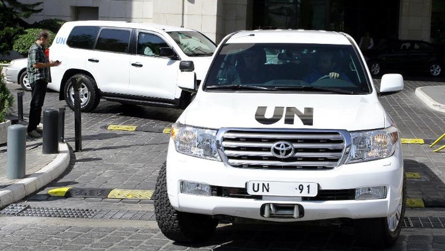 Des véhicules des experts en armes chimiques de l'ONU, le 29 septembre 2013 à Damas