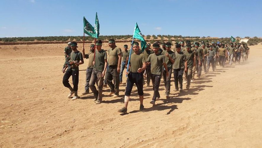 Des rebelles de la brigade Yarmuk dans la banlieue de Daraa, le 29 septembre 2013